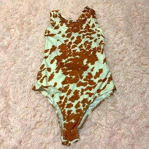Peach Love Cow print body suit Medium